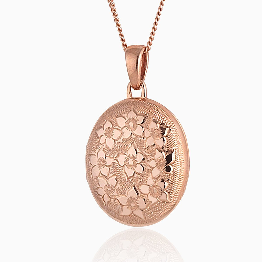 9 ct rose gold oval locket with a floral engraving on a 9 ct rose gold rope chain.