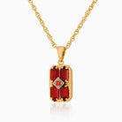 9 ct gold tabular shaped locket set with red garnets on a 9 ct gold rope chain