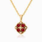 9 ct gold tipped square locket set with garnets and seed pearls, on a 9 ct rope chain