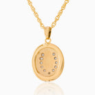 Back view of a 9 ct gold oval locket set with seed pearls in a horseshoe design and a glass back on a 9 ct gold rope chain