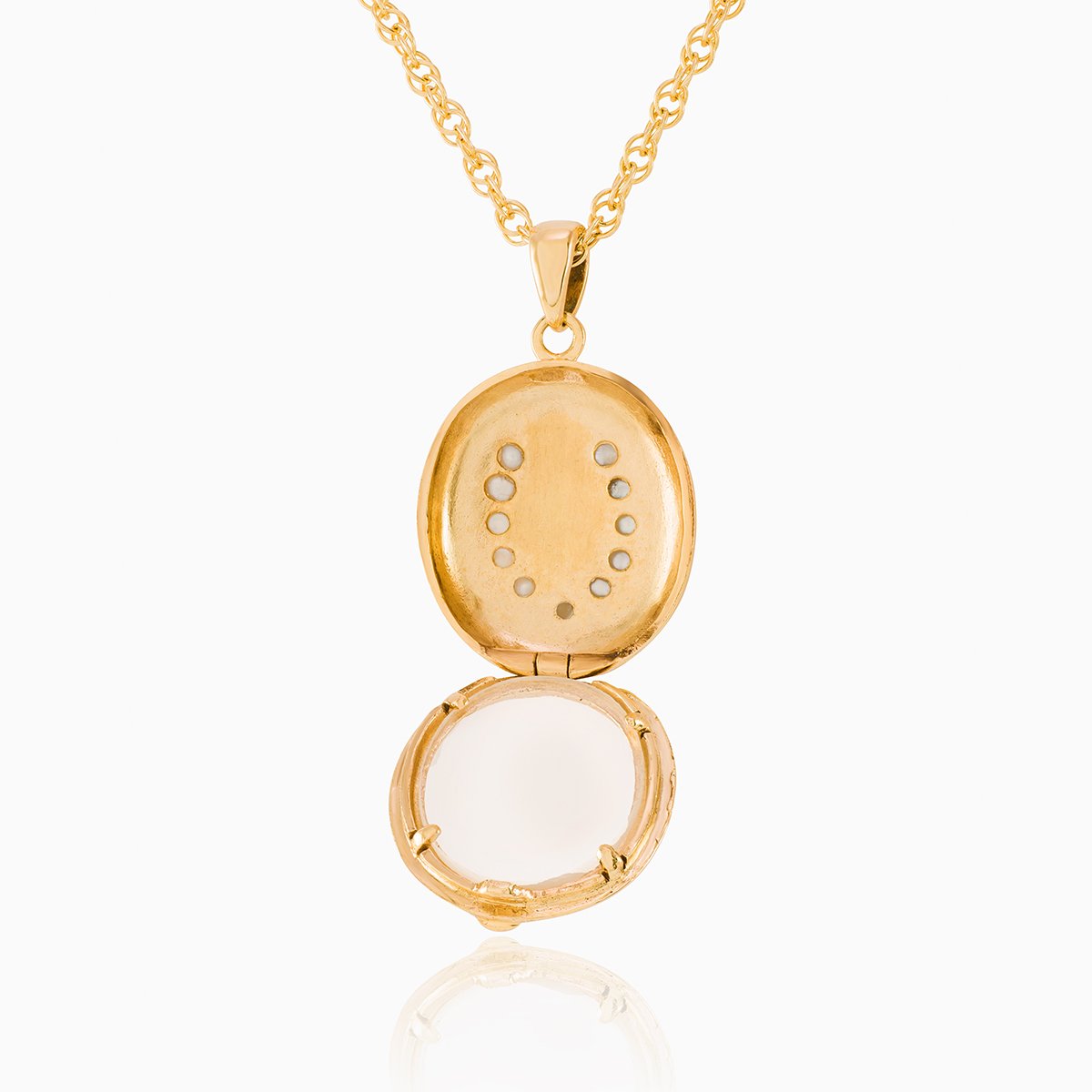 Open view of a 9 ct gold oval locket set with seed pearls in a horseshoe design and a glass back  on a 9 ct gold rope chain
