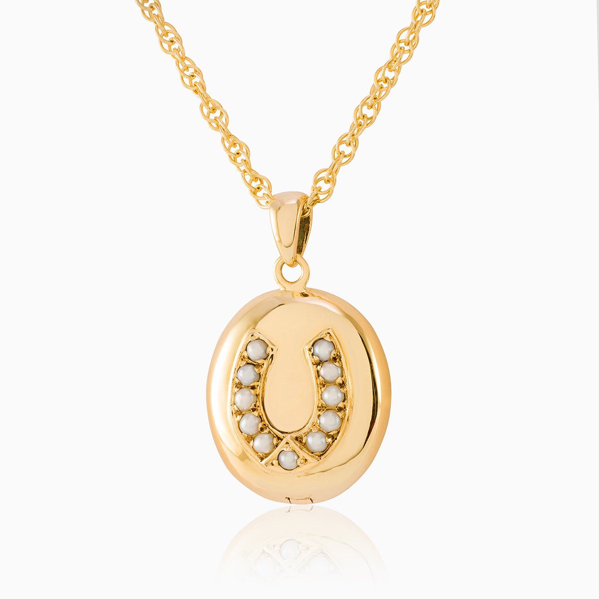 9 ct gold oval locket set with seed pearls in a horseshoe design on a 9 ct gold rope chain