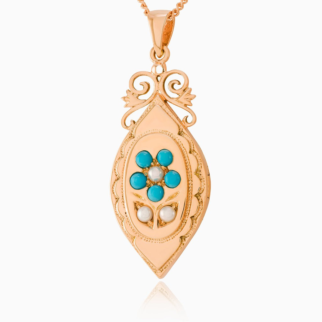9 ct rose gold elongated locket set with turquoise and seed pearls on a 9 ct rose gold curb chain
