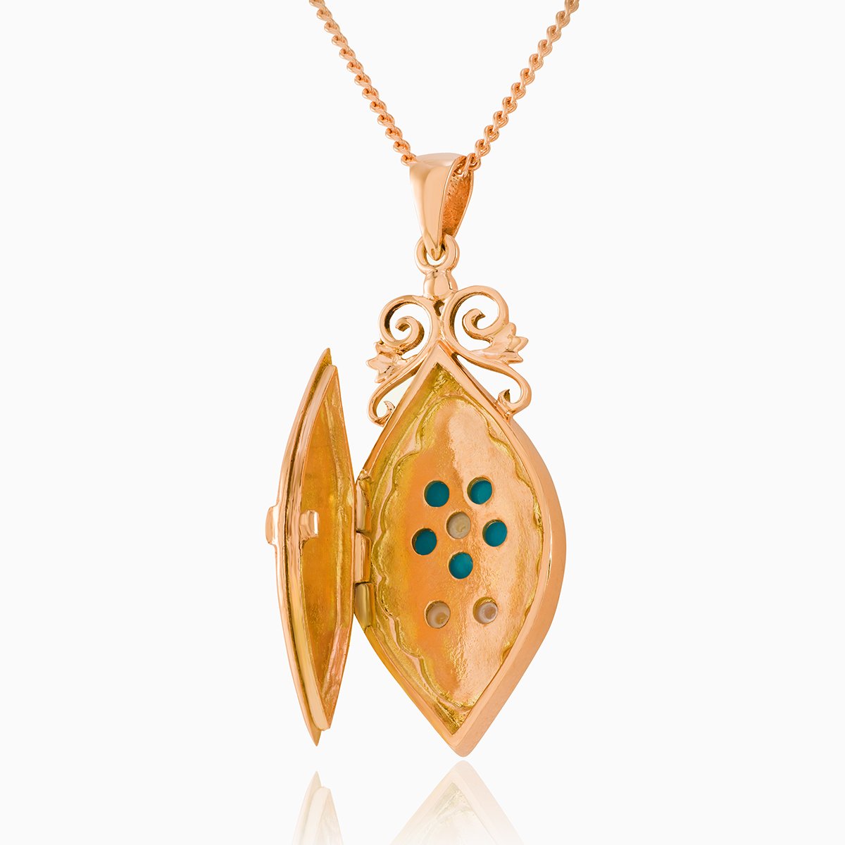 Open view of a 9 ct rose gold elongated locket set with turquoise and seed pearls on a 9 ct rose gold curb chain