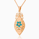 9 ct rose gold elongated locket set with turquoise and seed pearls on a 9 ct rose gold curb chain