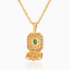 Open view of a tabular shaped 9 ct gold locket set with emeralds and diamonds , on a 9 ct gold rope chain