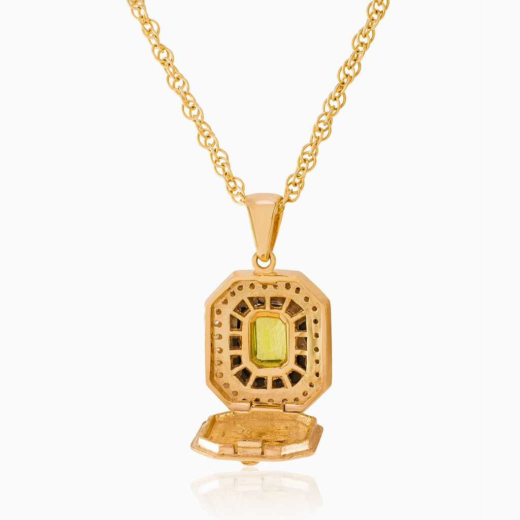 Open view of a 9 ct gold tabular shaped locket on a 9 ct gold rope chain