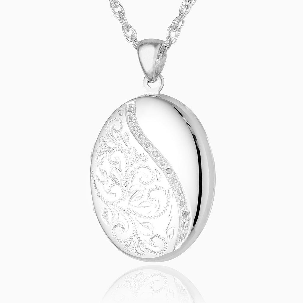 Sterling silver 925 oval locket with hand engraved design.