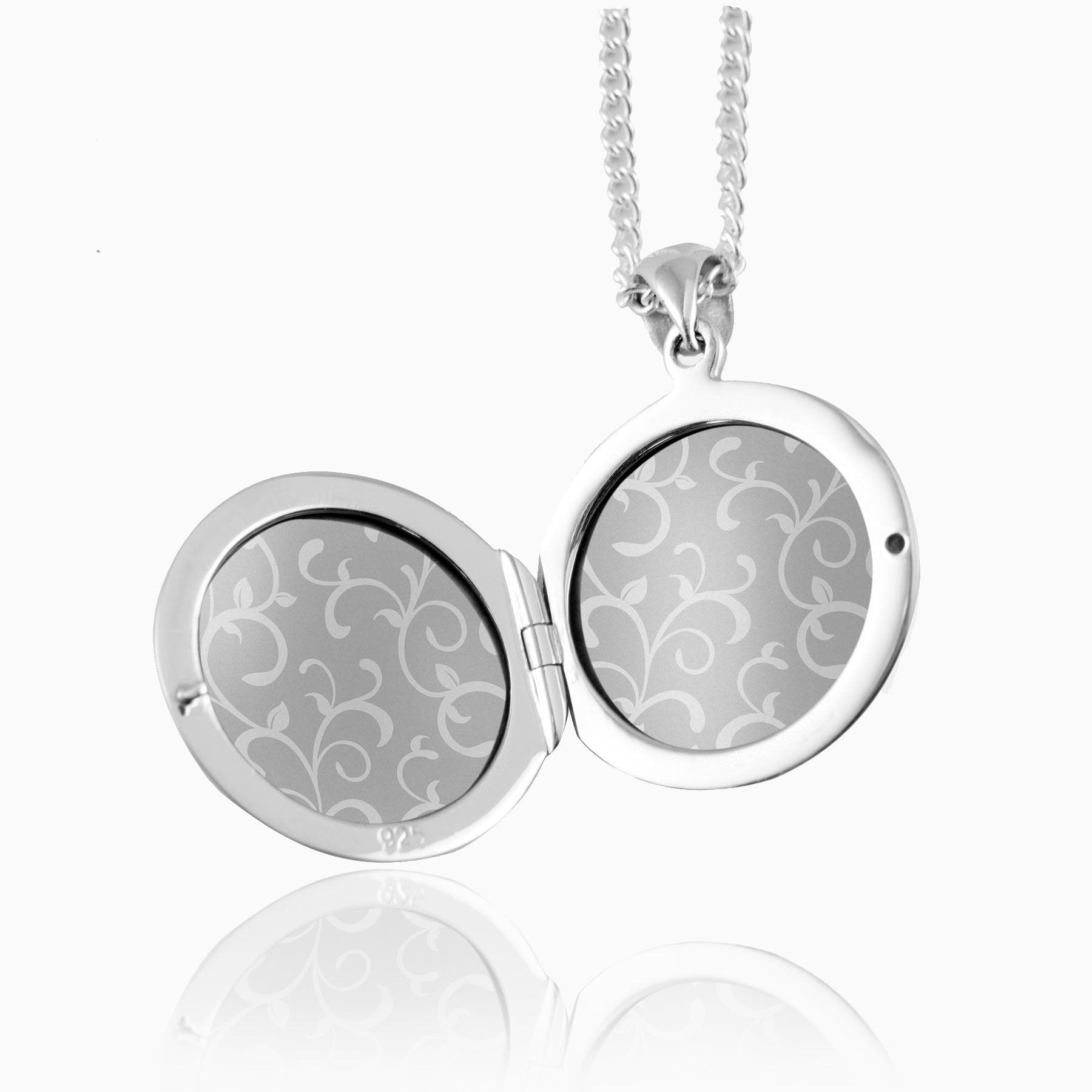 open view of a sterling silver round locket with grey inserts and perspexes