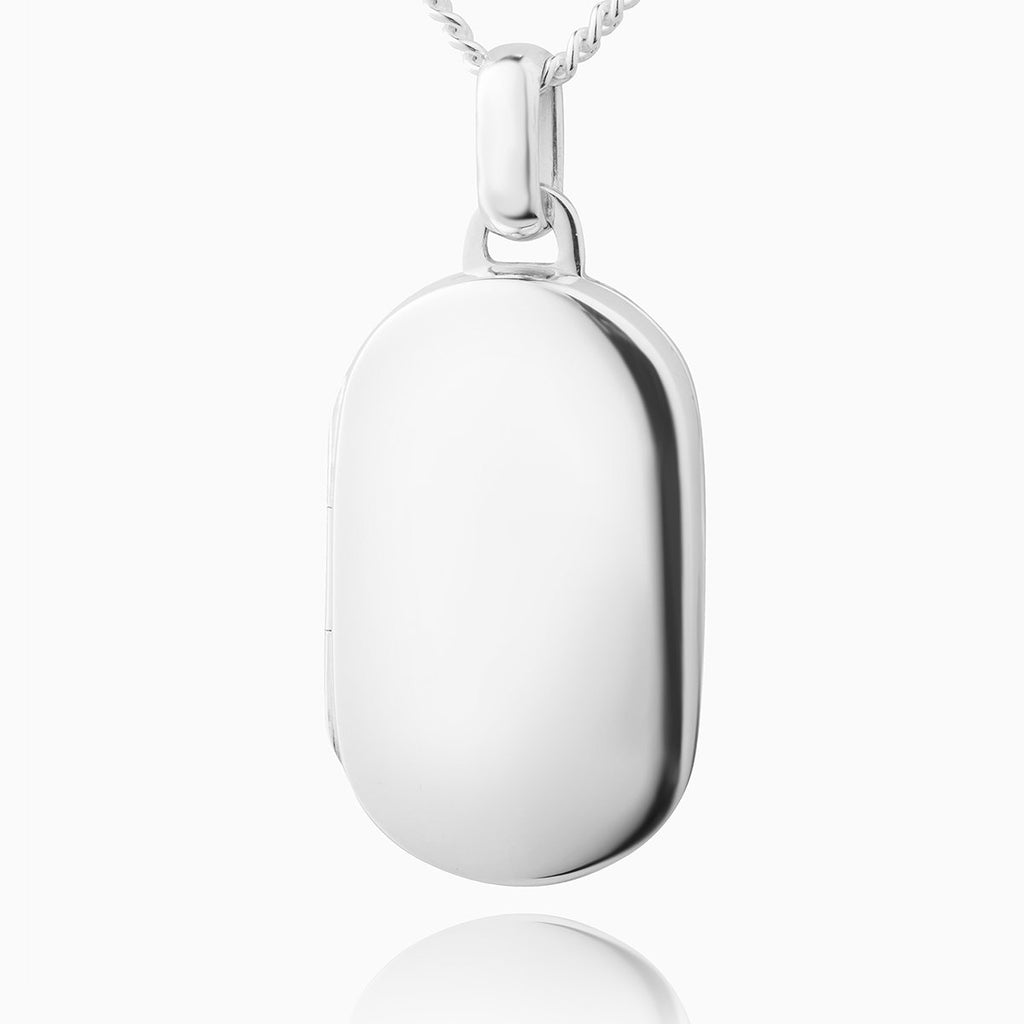A sterling silver dog tag shaped locket on a sterling silver curb chain
