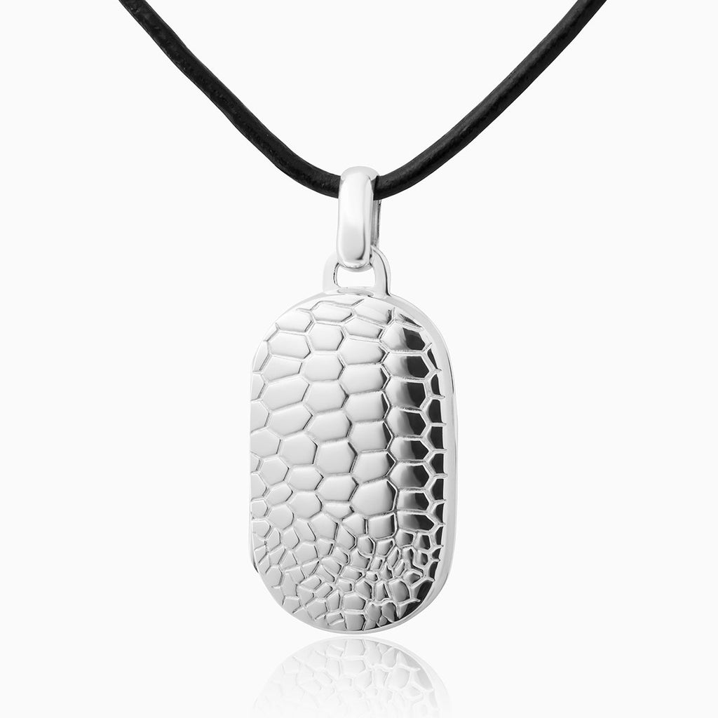 Sterling silver dog tag shaped locket embossed with a crocodile design on a black leather neck cord