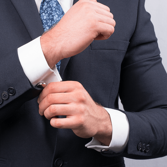 Model wearing sterling silver round cufflink lockets