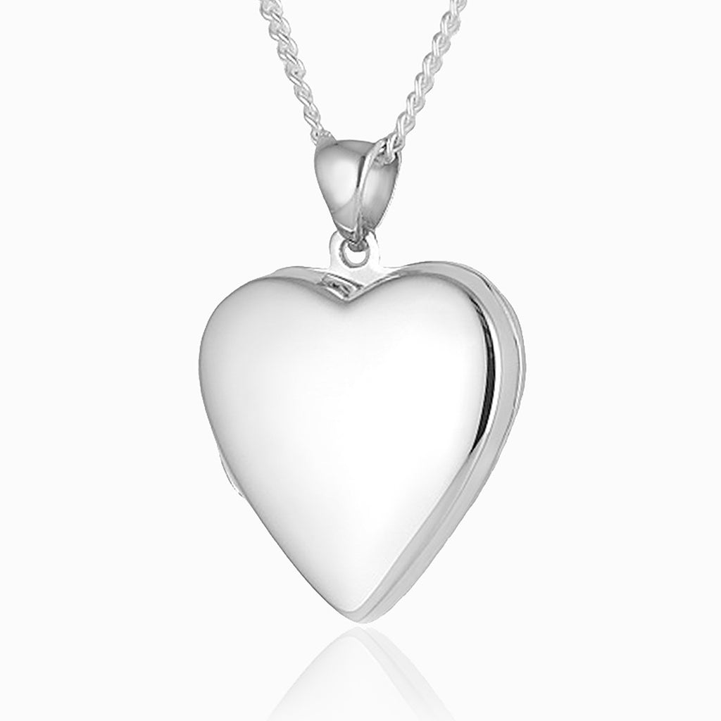 Front shot of a heart-shaped contemporary sterling silver heart locket on a sterling silver curb chain.
