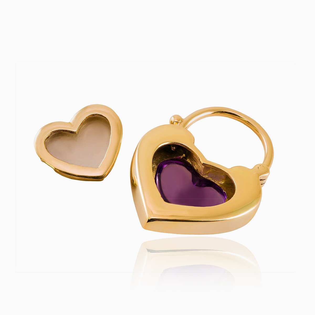 Open view of a 9 ct gold padlock shaped locket set with a purple cabochon amethyst stone