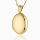 18 ct gold oval locket on an 18 ct gold franco chain