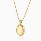 18 ct gold oval locket on an 18 ct gold franco chain
