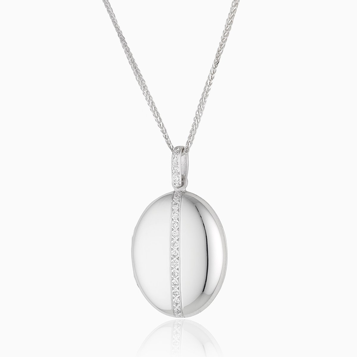 18 ct white gold oval locket set with a vertical line of diamonds. The bail is also set with diamonds. On an 18 ct white gold franco chain