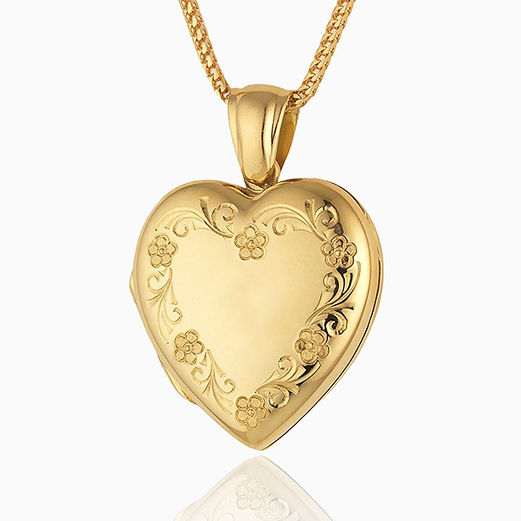 18 ct gold heart locket engraved with a floral border on an 18 ct gold franco chain