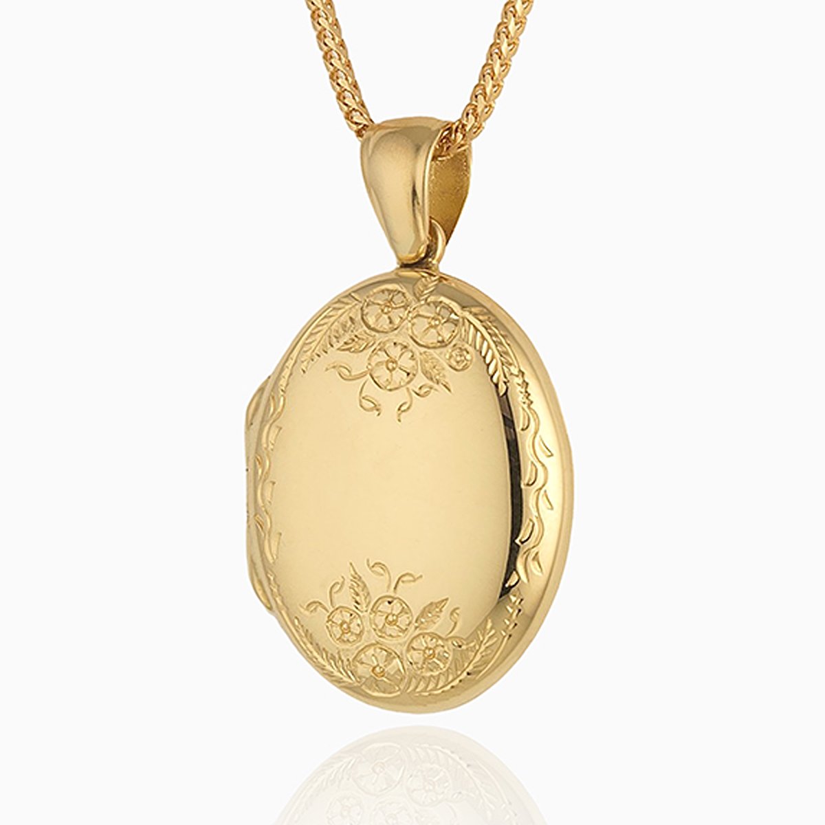 18 ct gold oval locket engraved with a floral design at the top and bottom of the locket, on an 18 ct gold franco chain
