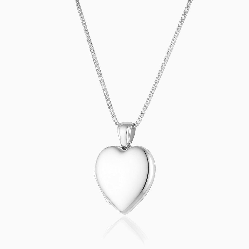 Platinum heart shaped locket on a platinum chain.