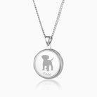 sterling silver round locket with a puppy engraved on the front and the name Coco underneath, on a sterling silver curb chain