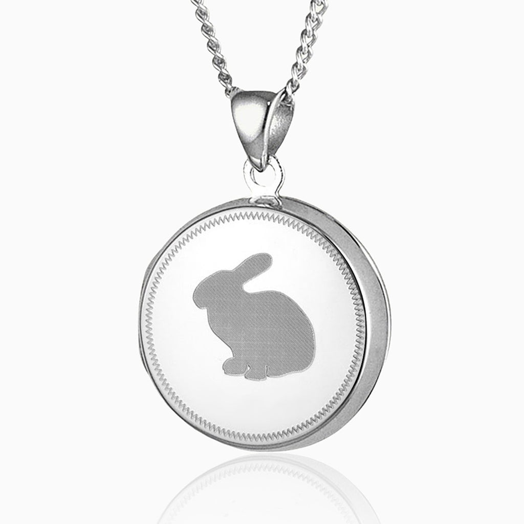 sterling silver round locket with a bunny silhouette engraved on the front