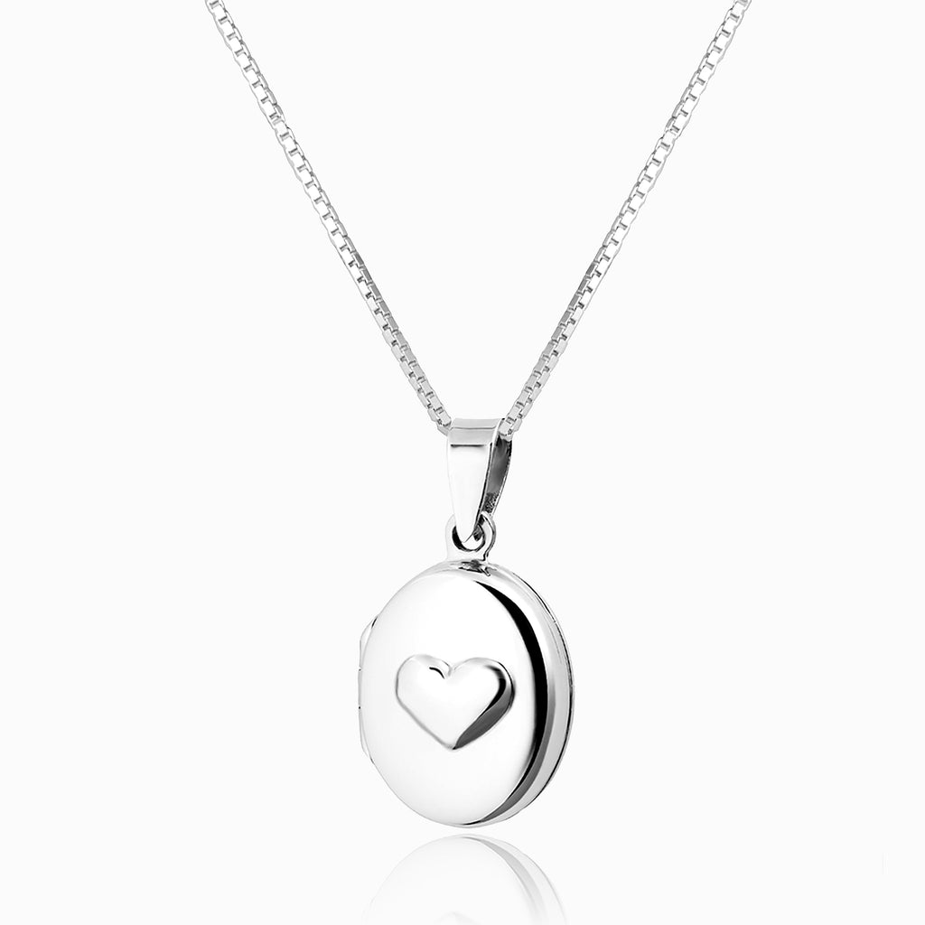 Small oval sterling silver locket embossed with a heart on the front, on a sterling silver box chain.