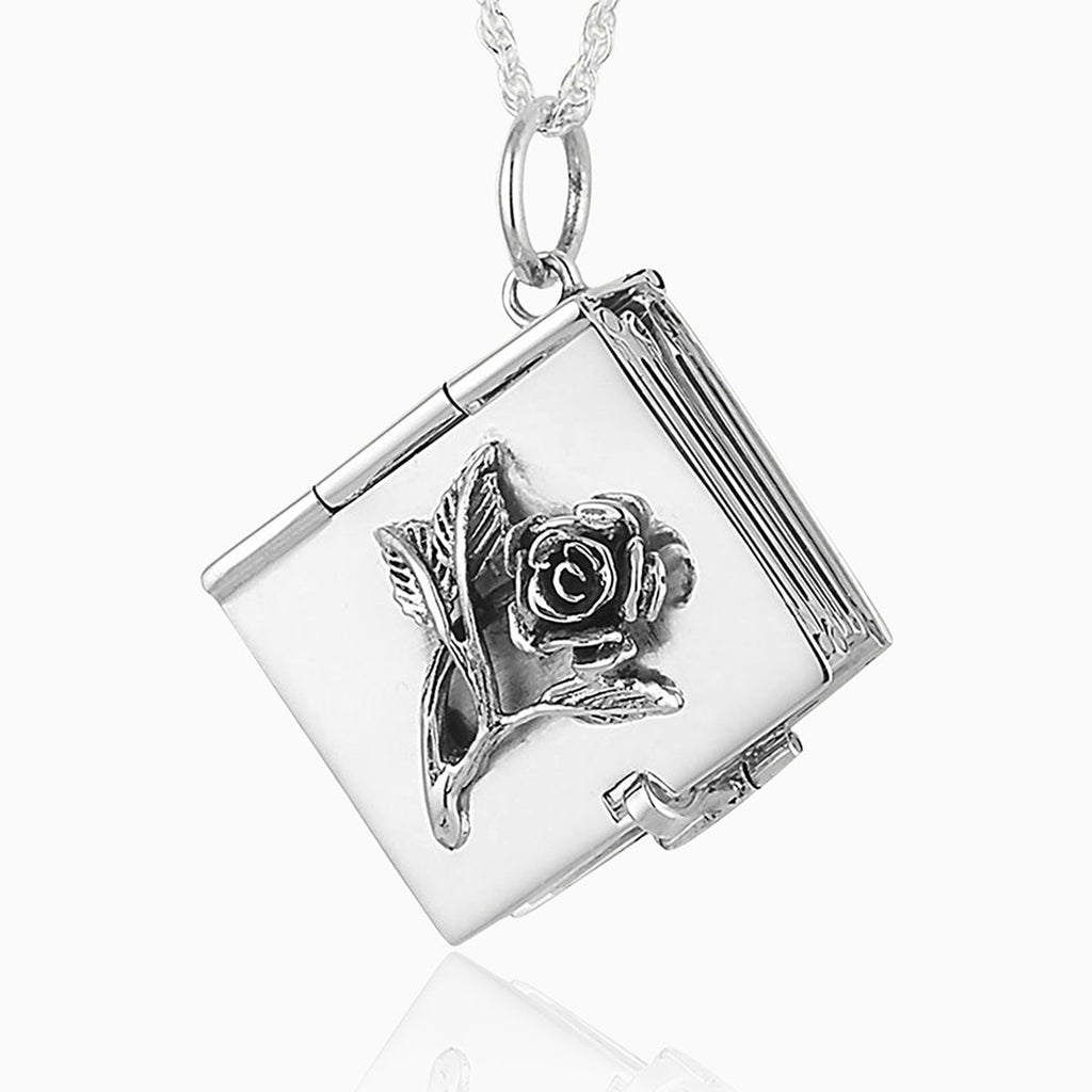 sterling silver book locket with a raised rose on the front, on a sterling silver rope chain