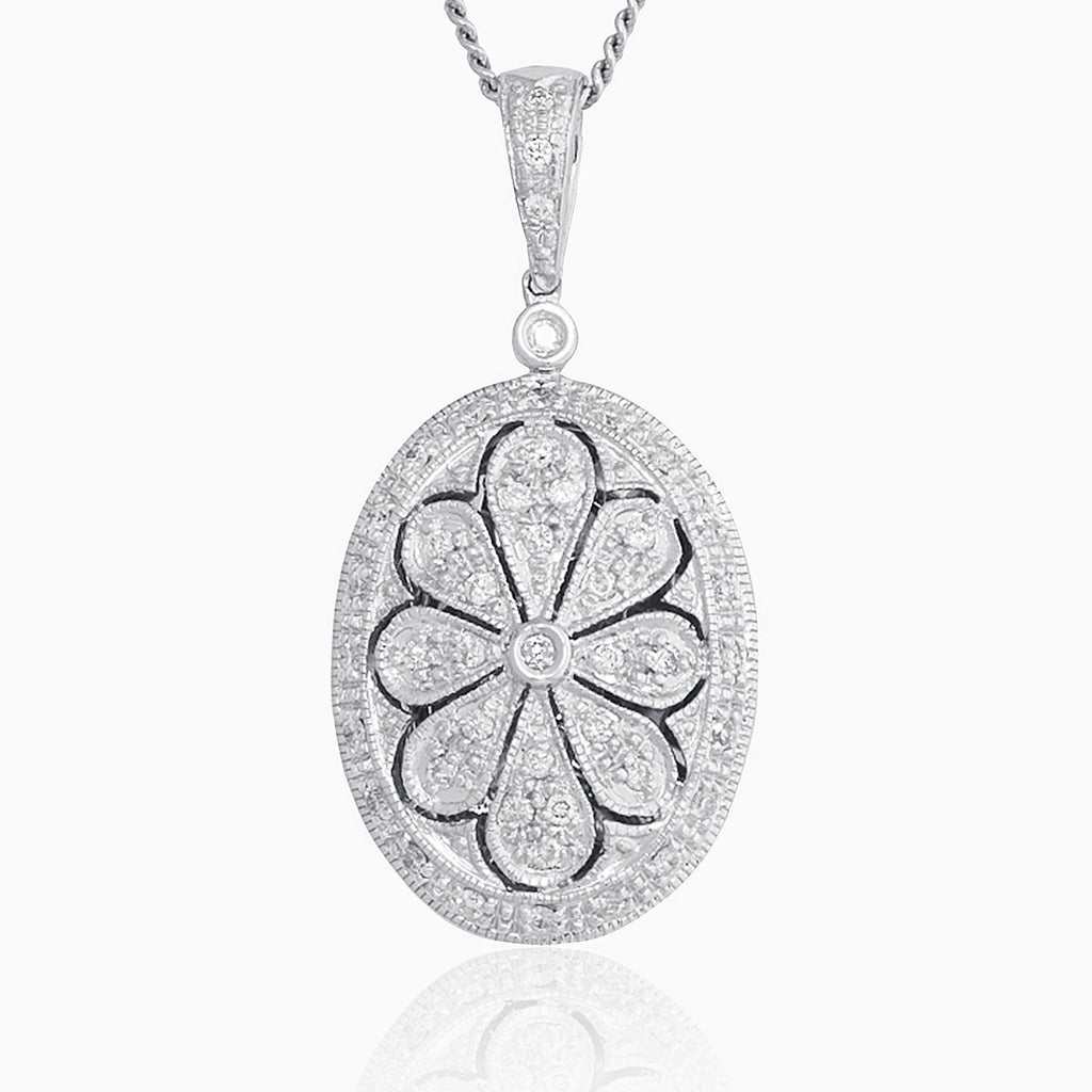 9 ct white gold oval locket pave set with diamonds in a floral design on a 9 ct white gold curb chain