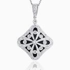 A tipped square 9 ct white gold locket set with diamonds and onyx. The bail is also set with diamonds. On a 9 ct white gold curb chain