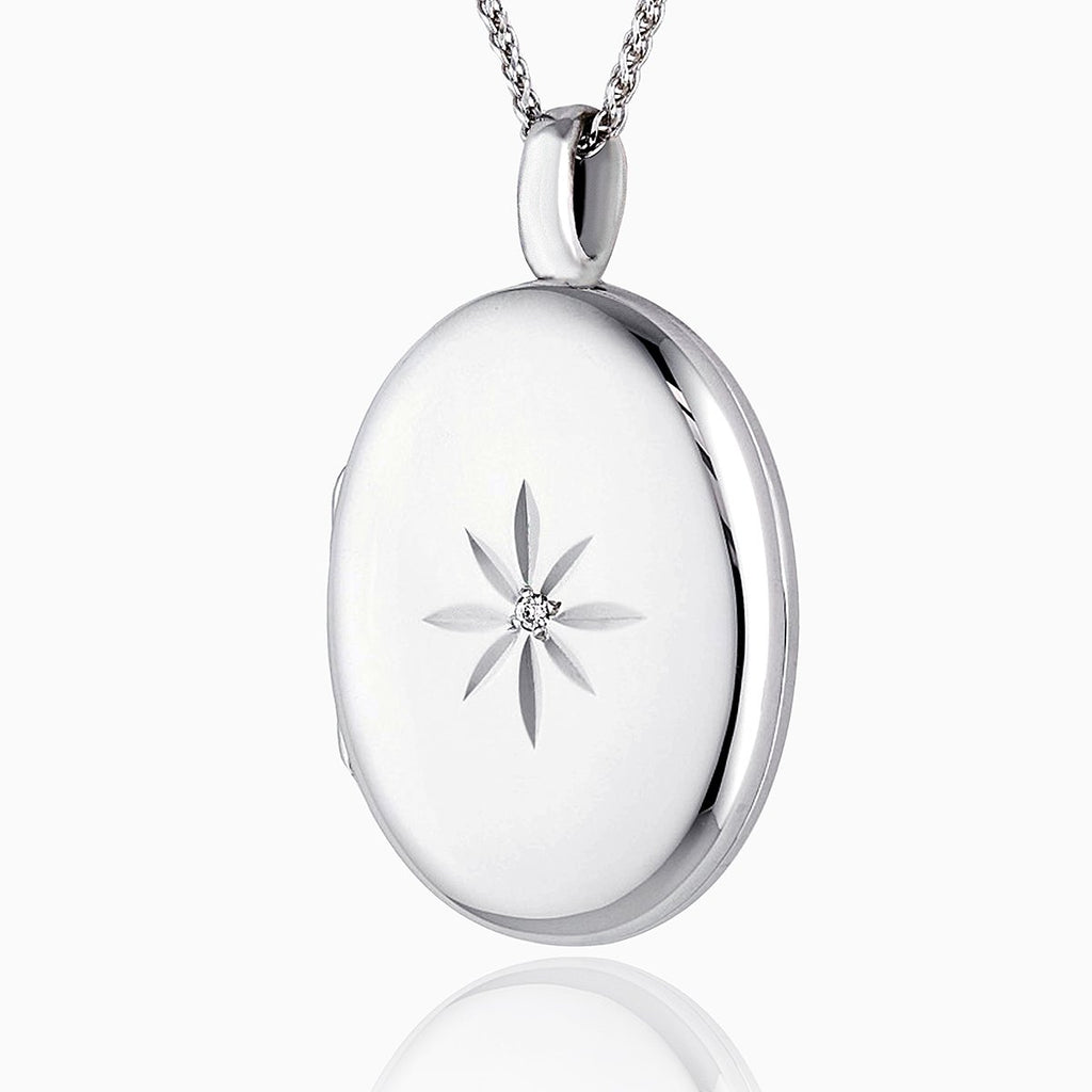 Large white gold oval locket star set with a diamond on a 9 ct white gold spiga chain