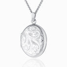 9 ct white gold oval locket engraved with a foliate design on a 9 ct white gold spiga chain