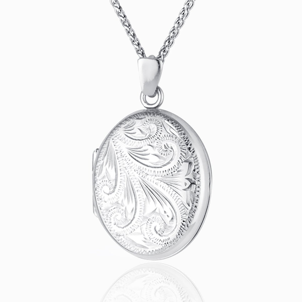 9 ct white gold oval locket engraved with a foliate design on a 9 ct white gold spiga chain