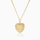 Front shot of a 9 ct gold engraved heart locket on a 9 ct gold curb chain.