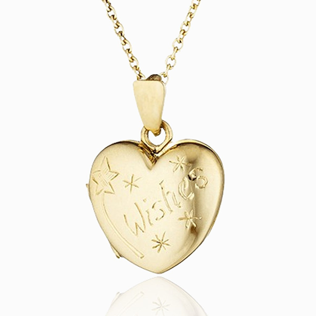 Child's 9 ct gold heart locket engraved with stars, a wand and the word Wishes on a 9 ct gold belcher chain.