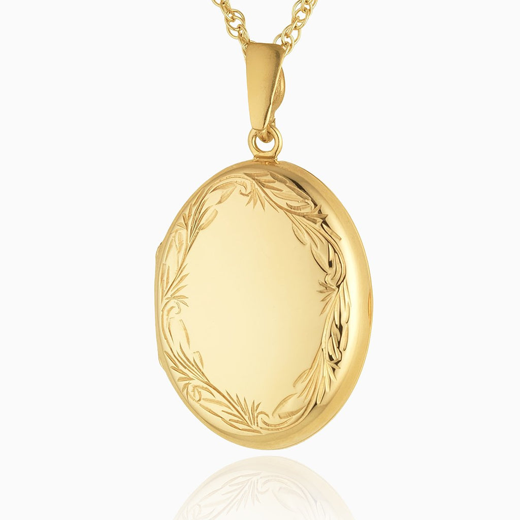 9 ct gold oval locket with an engraved border on a 9 ct gold rope chain