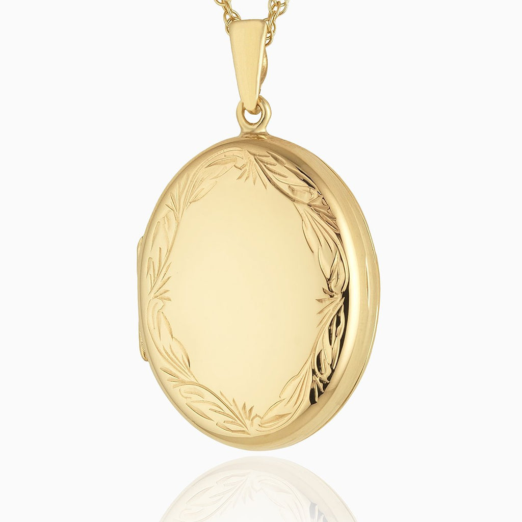 9 ct gold oval 4-photo locket with an engraved border on a 9 ct gold rope chain