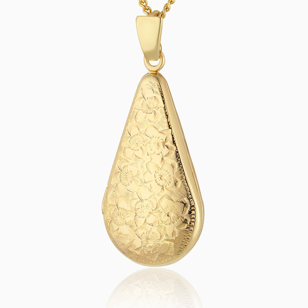 Front shot of a 9 ct gold floral slim locket set with a 9 ct gold curb chain. 