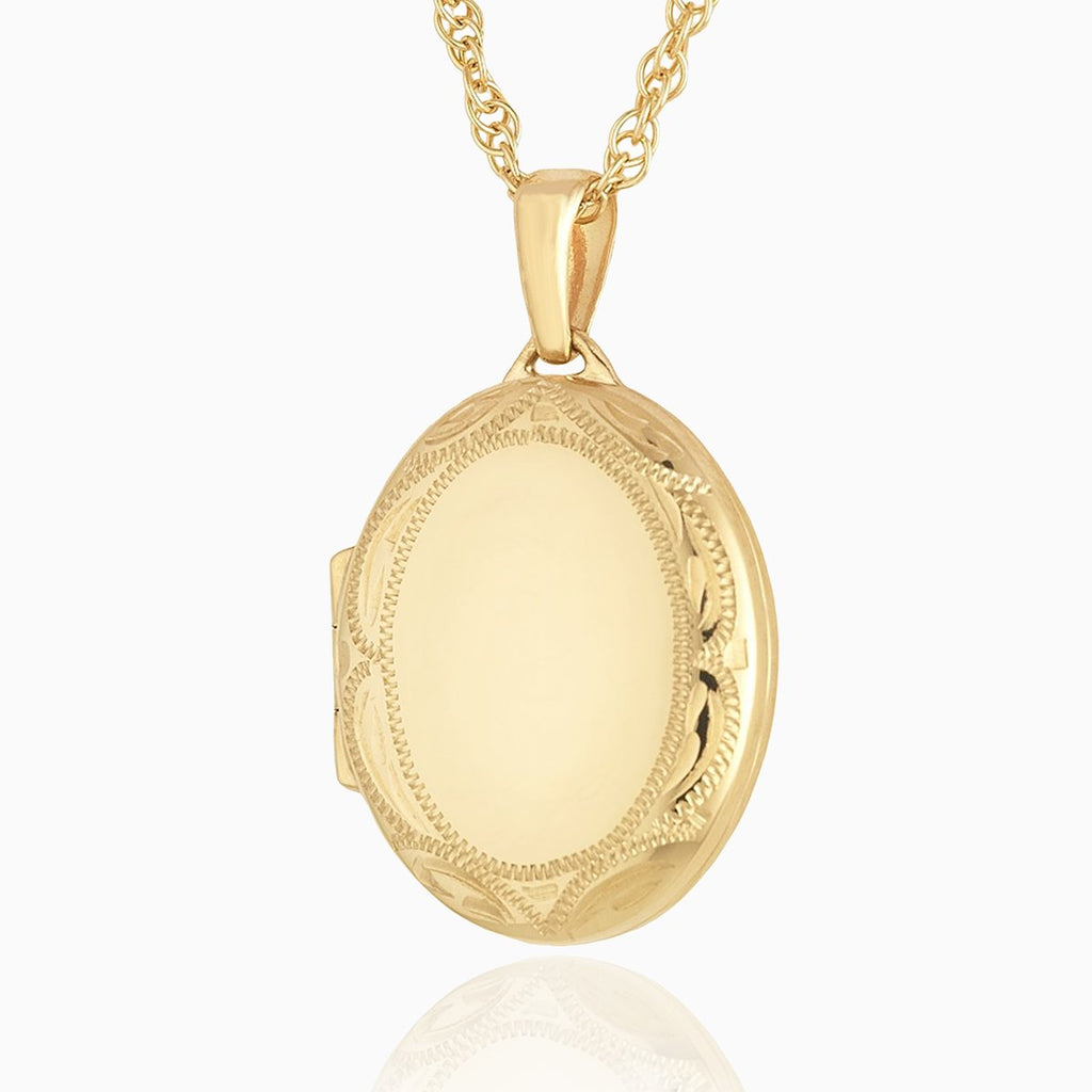 9 ct gold oval locket with an engraved border on a 9 ct gold rope chain