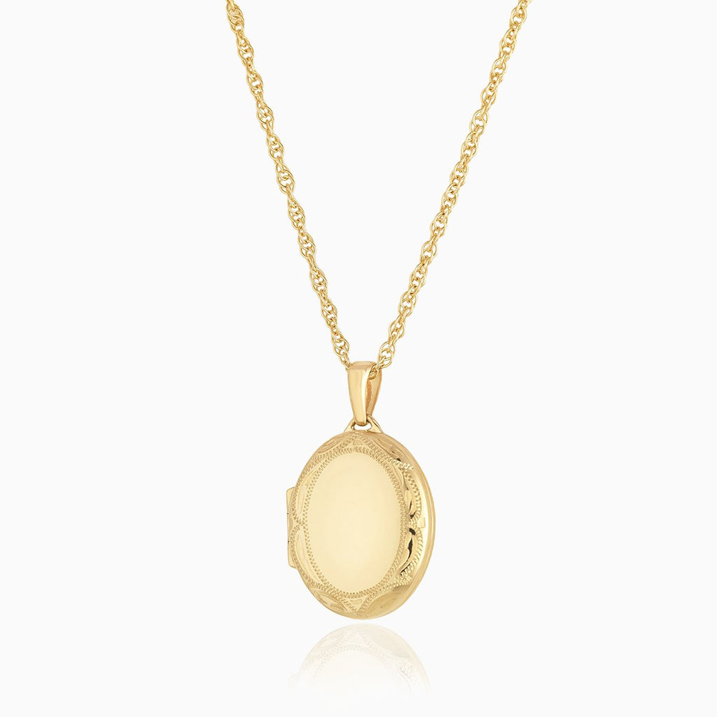 9 ct gold oval locket with an engraved border on a 9 ct gold rope chain