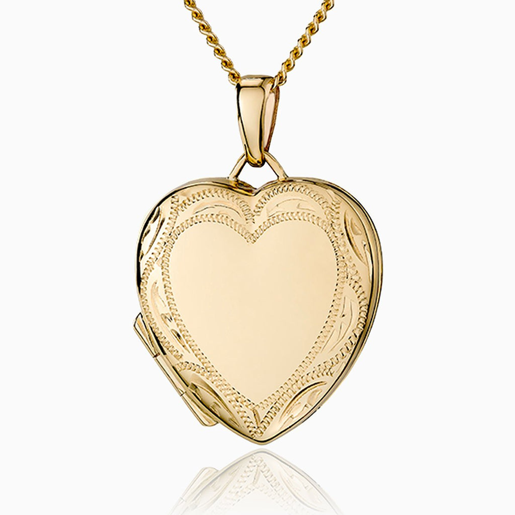 9 ct gold heart locket with an engraved border on a 9 ct gold curb chain