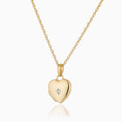 Front shot of a petite 9 ct gold heart locket set with a diamond on a 9 ct gold rope chain.