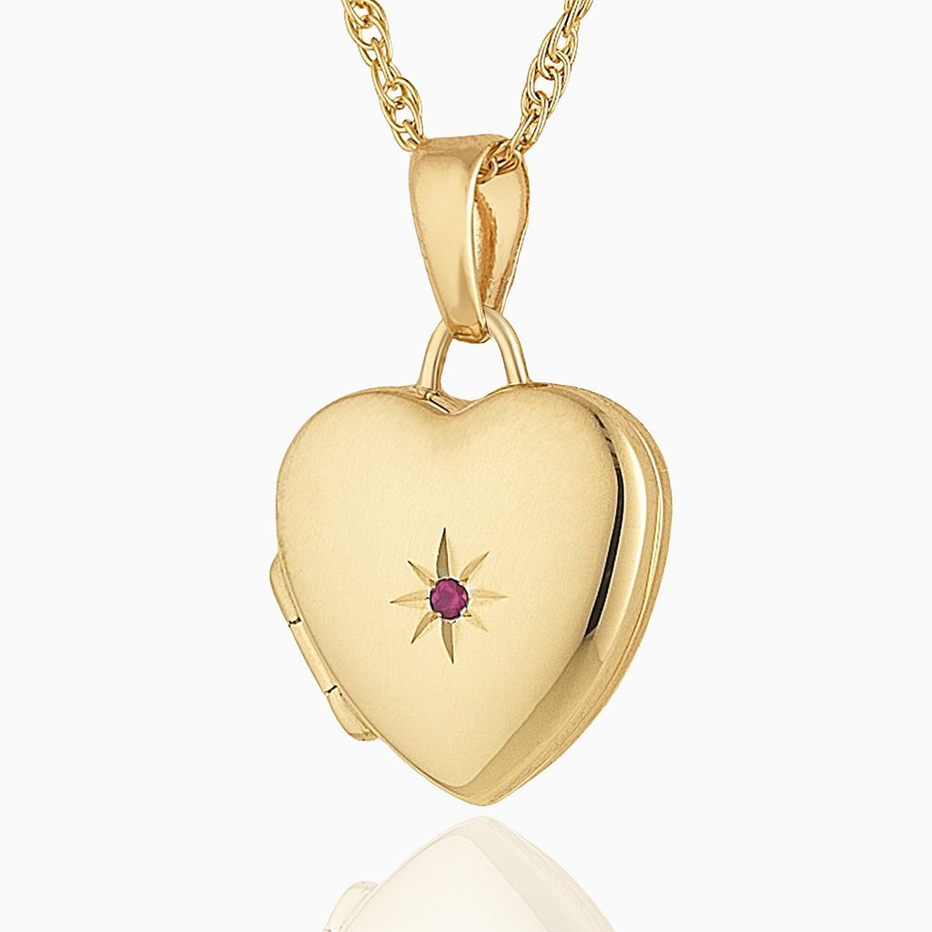 Petite 9 ct gold heart locket set with a ruby on a 9 ct gold rope chain.