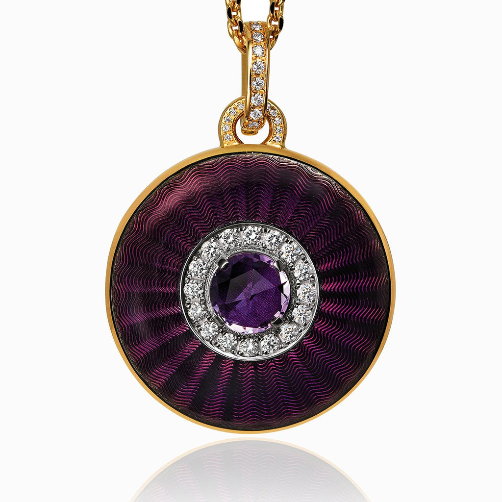 18 ct gold round locket set with purple guilloche enamel, a  purple amethyst stone and diamonds. The bail is also set with diamonds. On an 18 ct gold chain.
