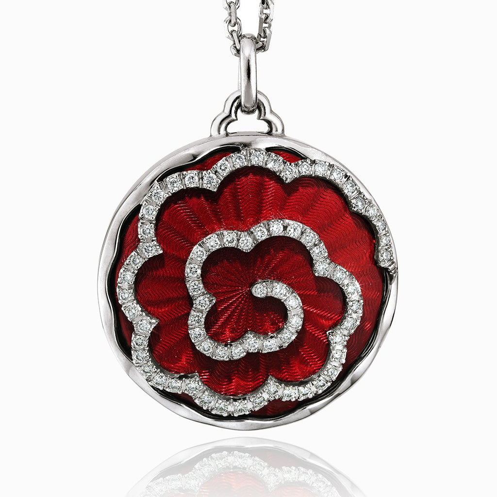 18 ct round locket with a red guilloche enamel background and daimonds aranged in a floral design on an 18 ct white gold chain