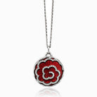 18 ct round locket with a red guilloche enamel background and daimonds aranged in a floral design on an 18 ct white gold chain