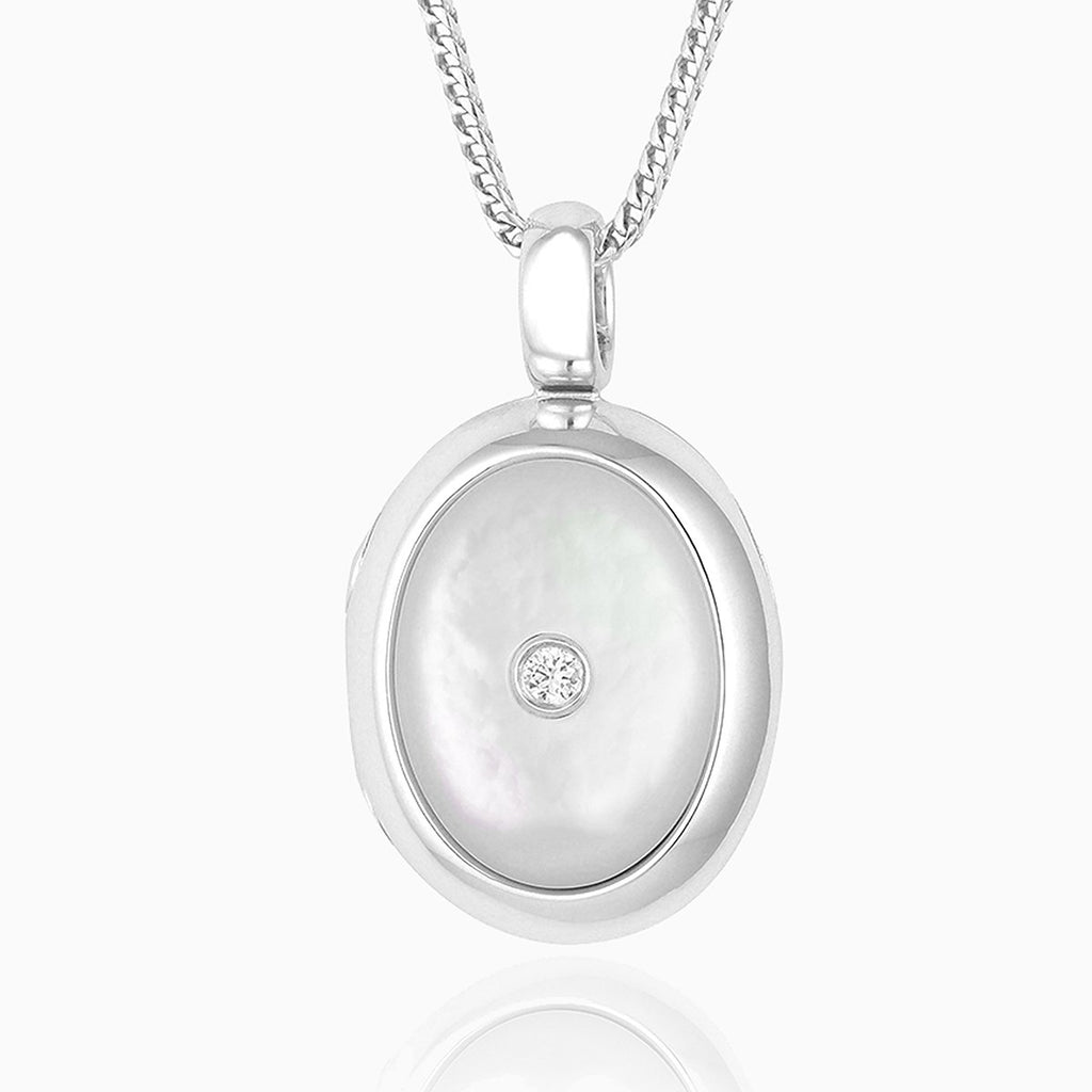 18 ct white gold oval locket set with mother of pearl and a diamond in the centre, on an 18 ct white gold franco chain