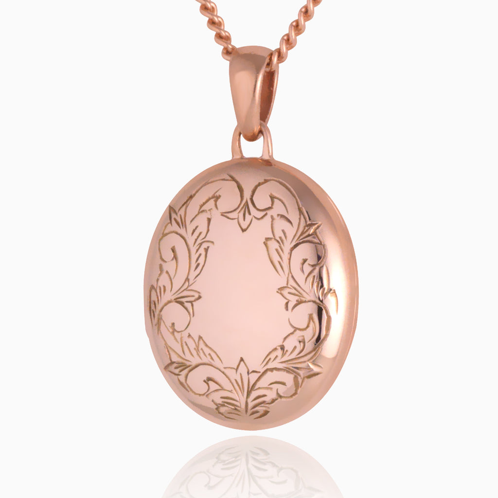 Front shot of a premium 9 ct rose gold foliate border locket set on matching 9 ct rose gold curb chain. 
