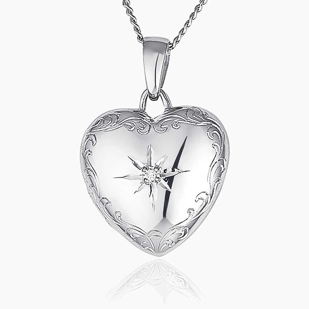 9 ct white gold heart locket set with a diamond on a 9 ct white gold curb chain.