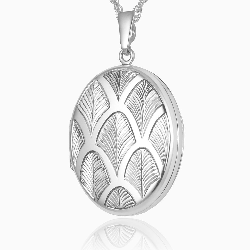 sterling silver 4-photo oval locket with an art deco palmette style design on the front